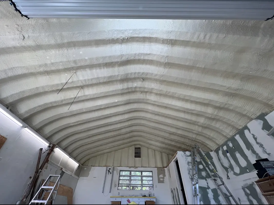 Spray polyurethane foam applied to the underside of a metal roof deck in Kaukauna